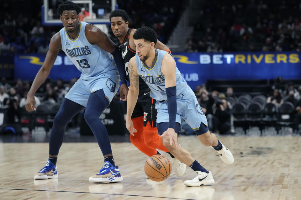 Memphis Grizzlies guard Scotty Pippen Jr. (1) drives during the first half of an NBA basketball game against the Detroit Pistons, Monday, April 1, 2024, in Detroit. (AP Photo/Carlos Osorio)