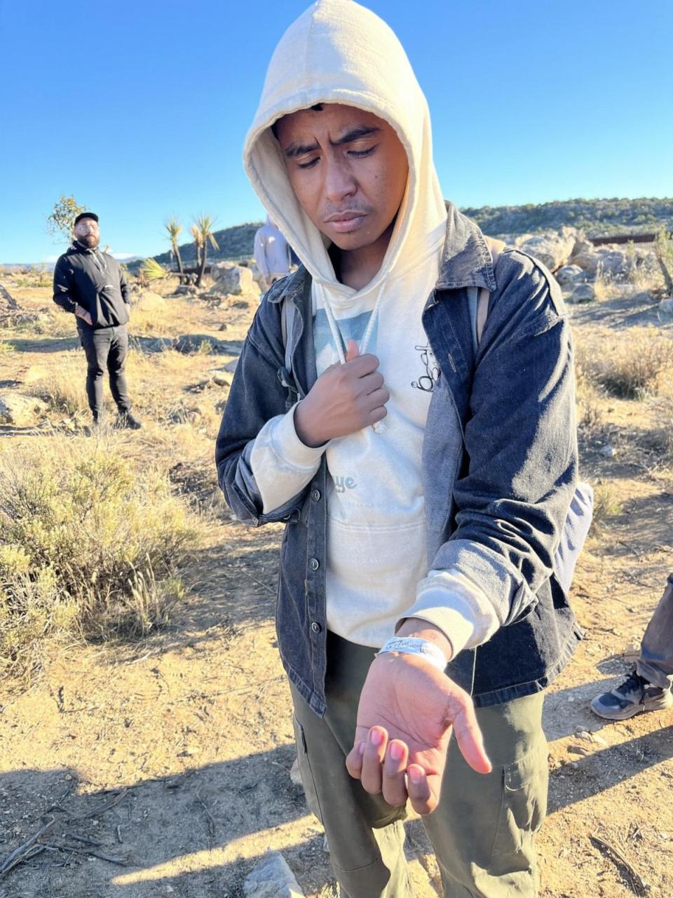 PHOTO: A migrant is shown wearing a white bracelet given to him by Border Patrol agent. (Mireya Villarreal/ABC News)