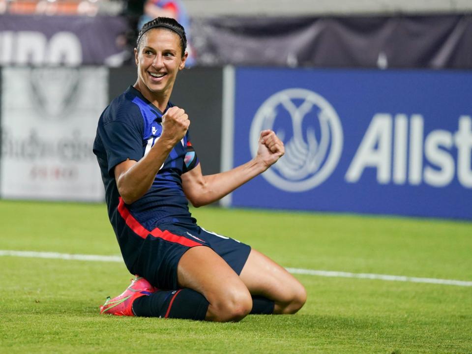 Carli Lloyd celebrates scoring a goal for the US Women's National Team.