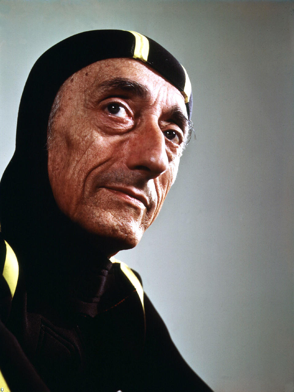 This image released by National Geographic shows Jacques Cousteau in a diving suit in 1972, from the documentary “Becoming Cousteau,” opening in theaters Friday. The film attempts to frame the singular Cousteau and his legacy as an early environmental defender of increasingly imperiled waters. (Yousuf Karsh/National Geographic via AP)