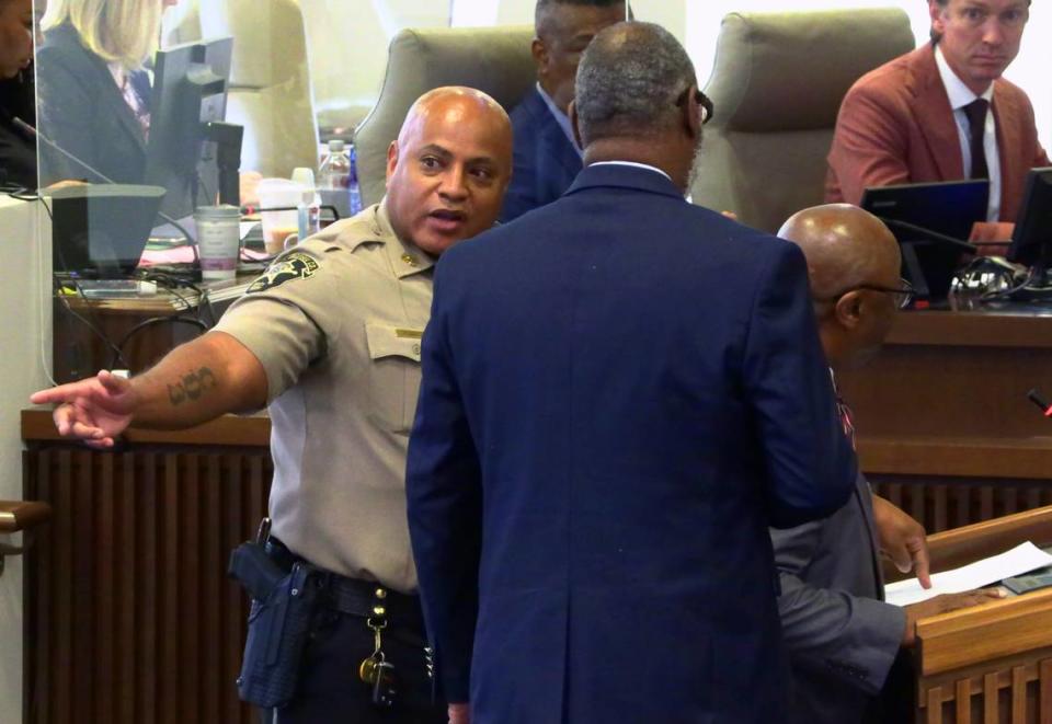 Local NAACP President Wane Hailes, center, back to camera, and Rev. J.H. Flakes III of Fourth Street Missionary Baptist Church, at podium, right, asked to speak before council’s vote to confirm Stoney Mathis as the new police chief in Columbus, Georgia. 10/10/2023