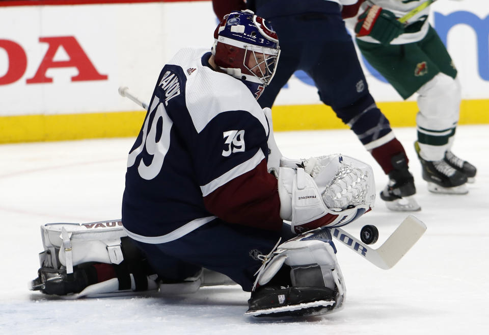 Colorado Avalanche goaltender Pavel Francouz makes a stick-save of a shot in the second period of an NHL hockey game against the Minnesota Wild, Friday, Dec. 27, 2019, in Denver. (AP Photo/David Zalubowski)