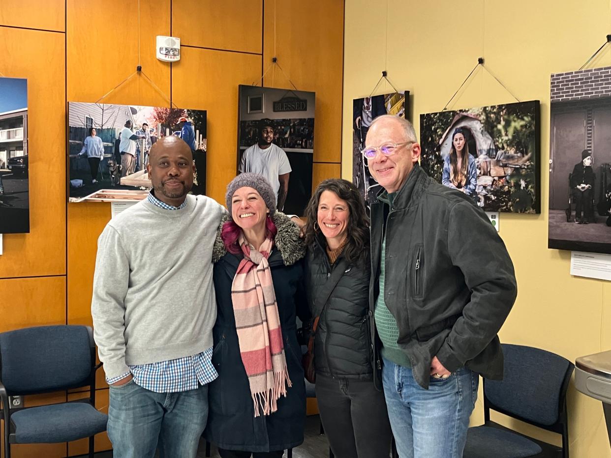 Chris Lassiter, from left, Miriam Burrows, Kate Simon and Dan Layman were all key on the This is Home project that tells the story of housing insecurity in our area. The photo gallery part of the project is now hanging at Blue Ridge Community College.