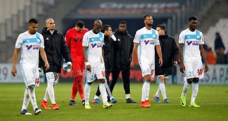 Football Soccer - Marseille v Paris St Germain - French Ligue 1 - Orange Velodrome stadium, Marseille, France - 26/02/2017 - Olympique Marseille's players walk on the pitch at the end of the match. REUTERS/Jean-Paul Pelissier