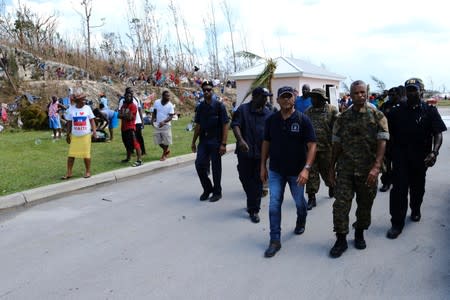 Government officials survey the grounds of the Government Complex in the aftermath of Hurricane Dorian in Marsh Harbour