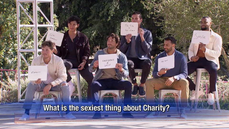 The men give Charity a sign on 'The Bachelorette'