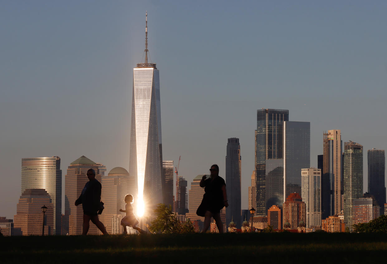 JERSEY CITY, NJ - SEPTEMBER 7: The setting sun reflects off the windows of One World Trade Center in New York City on September 7, 2021 as seen from Jersey City, New Jersey. (Photo by Gary Hershorn/Getty Images)