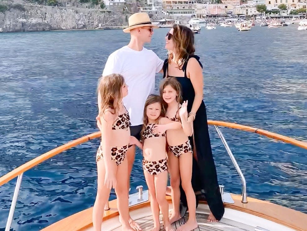 Diana Blinkhorn smiling with family on boat