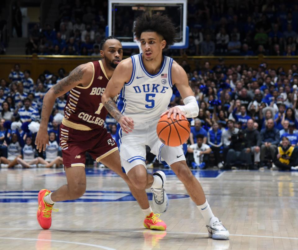 Duke guard Tyrese Proctor (5) drives to the basket against Boston College guard Claudell Harris Jr. (1) during their game at Cameron Indoor Stadium.