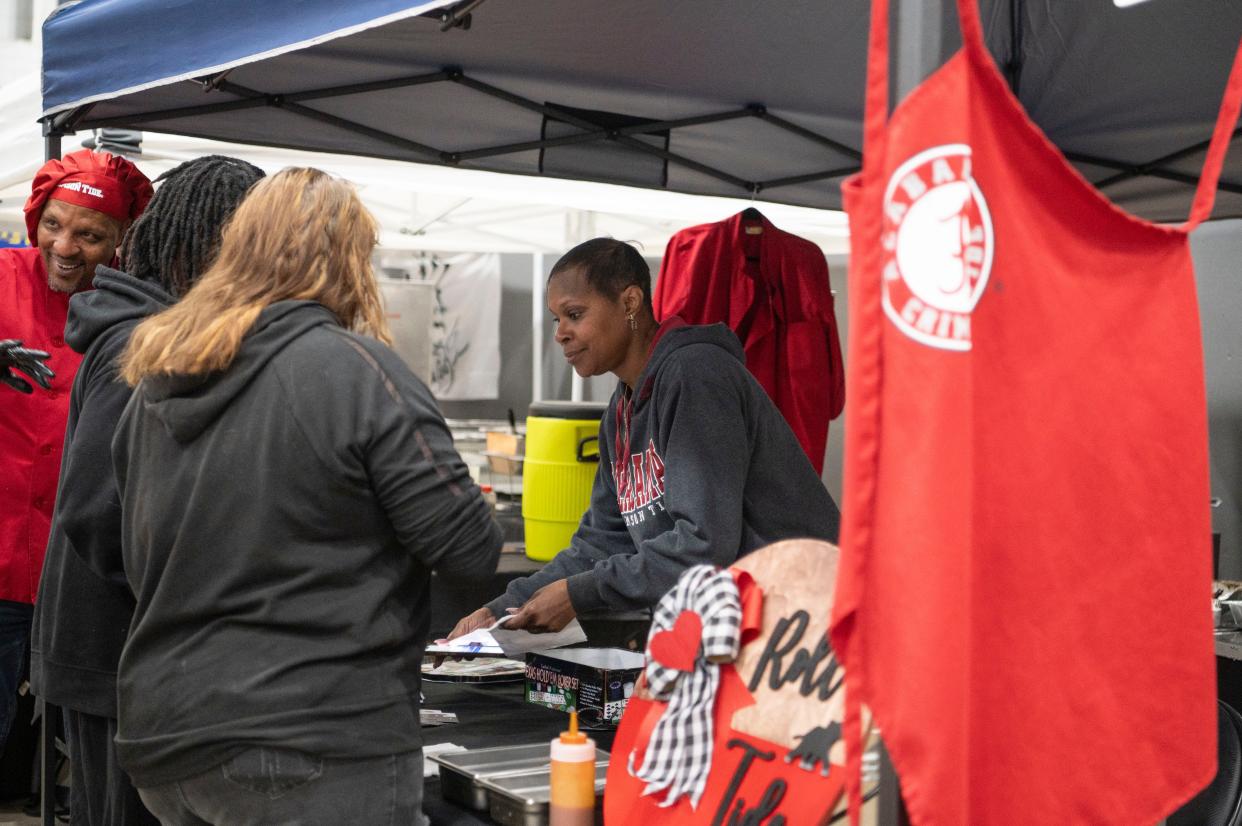 Wendy Reid-Carter of Ms. Coleman's serves guests during The Big Cheese Mac and Cheese Festival at Kellogg Arena on Saturday, April 20, 2024.