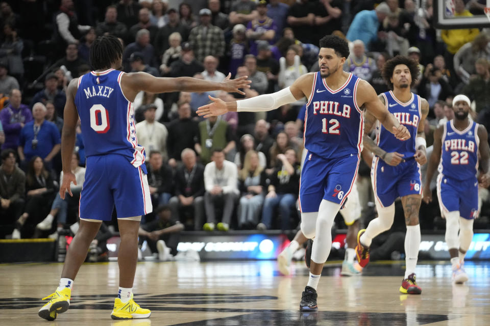 Philadelphia 76ers' Tobias Harris (12) celebrates with Tyrese Maxey (0) after scoring against the Utah Jazz during the second half of an NBA basketball game Thursday, Feb. 1, 2024, in Salt Lake City. (AP Photo/Rick Bowmer)