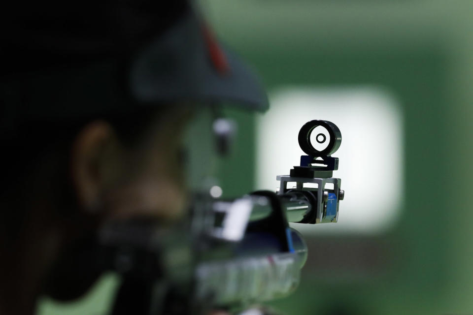 Yi Siling practices during the Women’s 10m Air Rifle competition