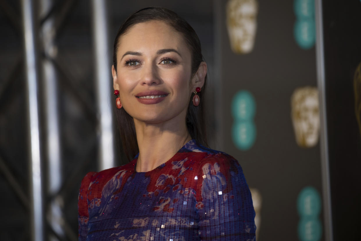 Olga Kurylenko poses for photographers upon arrival at the BAFTA Film Awards in London, Sunday, Feb. 10, 2019. (Photo by Vianney Le Caer/Invision/AP)