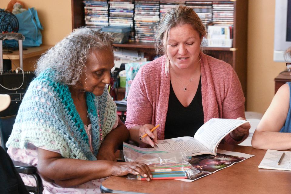 Crestivew Manor Facility Director Lavina Brock visits with manor resident Mary Matthews on Friday. The Crestview Manor will be celebrating its 40th anniversary Saturday, when the manor's new Ruth Lovejoy Day Center will be unveiled. The center will allow Crestview residents to drop off family members for whom they are caring for the day to be supervised by manor staff, allowing the family member time to take care of their own needs.