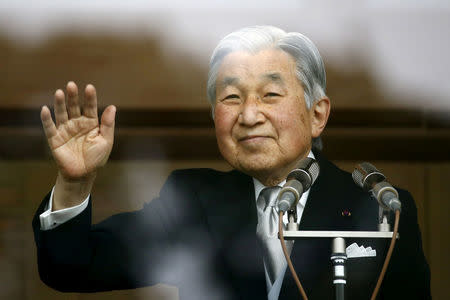 Japan's Emperor Akihito waves to well-wishers who gathered at the Imperial Palace to mark his 82nd birthday in Tokyo, Japan, December 23, 2015. REUTERS/Thomas Peter/File Photo