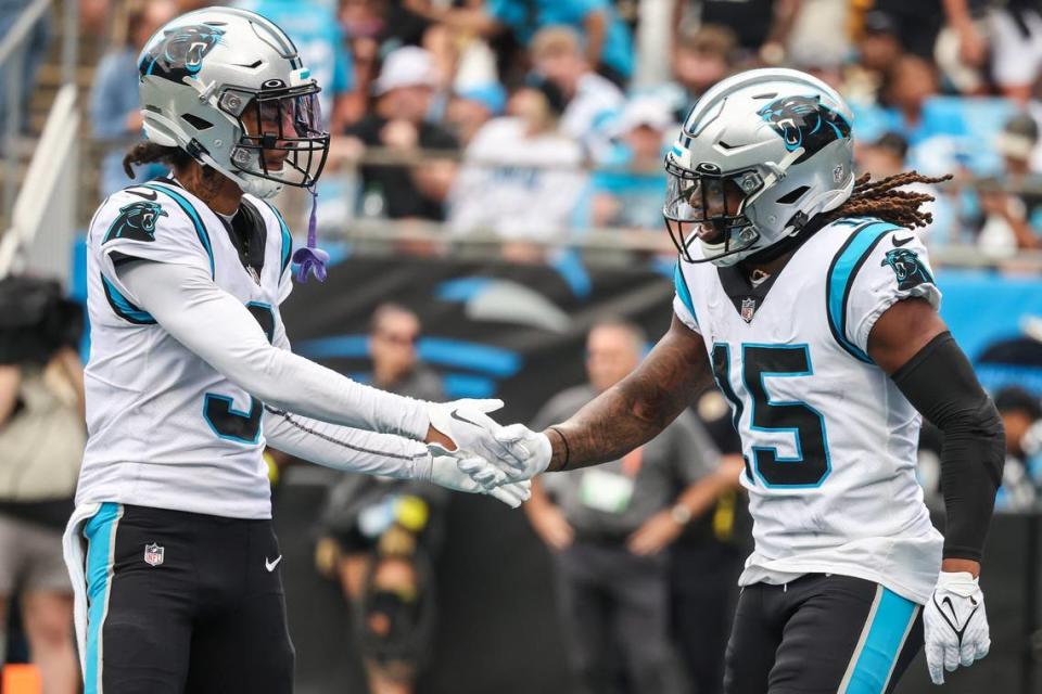 Panthers wide receiver Robbie Anderson, left, congratulates teammate Laviska Shenault, Jr. after he scored a touchdown during the game against the Saints at Bank of America Stadium on Sunday, September 25, 2022 in Charlotte, NC. The Panthers pulled out their first win of the season by defeating the Saints 22-14. Melissa Melvin-Rodriguez/mrodriguez@charlotteobserver.com