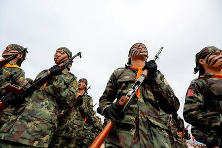 Soldiers from the Shan State Army-South march in formation during a military parade celebrating the 69th Shan State National Day at Loi Tai Leng, the group's headquarters, on the Thai-Myanmar border February 7, 2016. REUTERS/Soe Zeya Tun