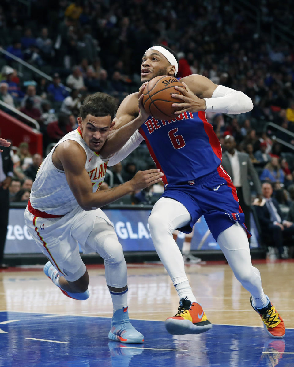 Detroit Pistons guard Bruce Brown (6) drives on Atlanta Hawks guard Trae Young during the first half of an NBA basketball game Friday, Nov. 22, 2019, in Detroit. (AP Photo/Carlos Osorio)