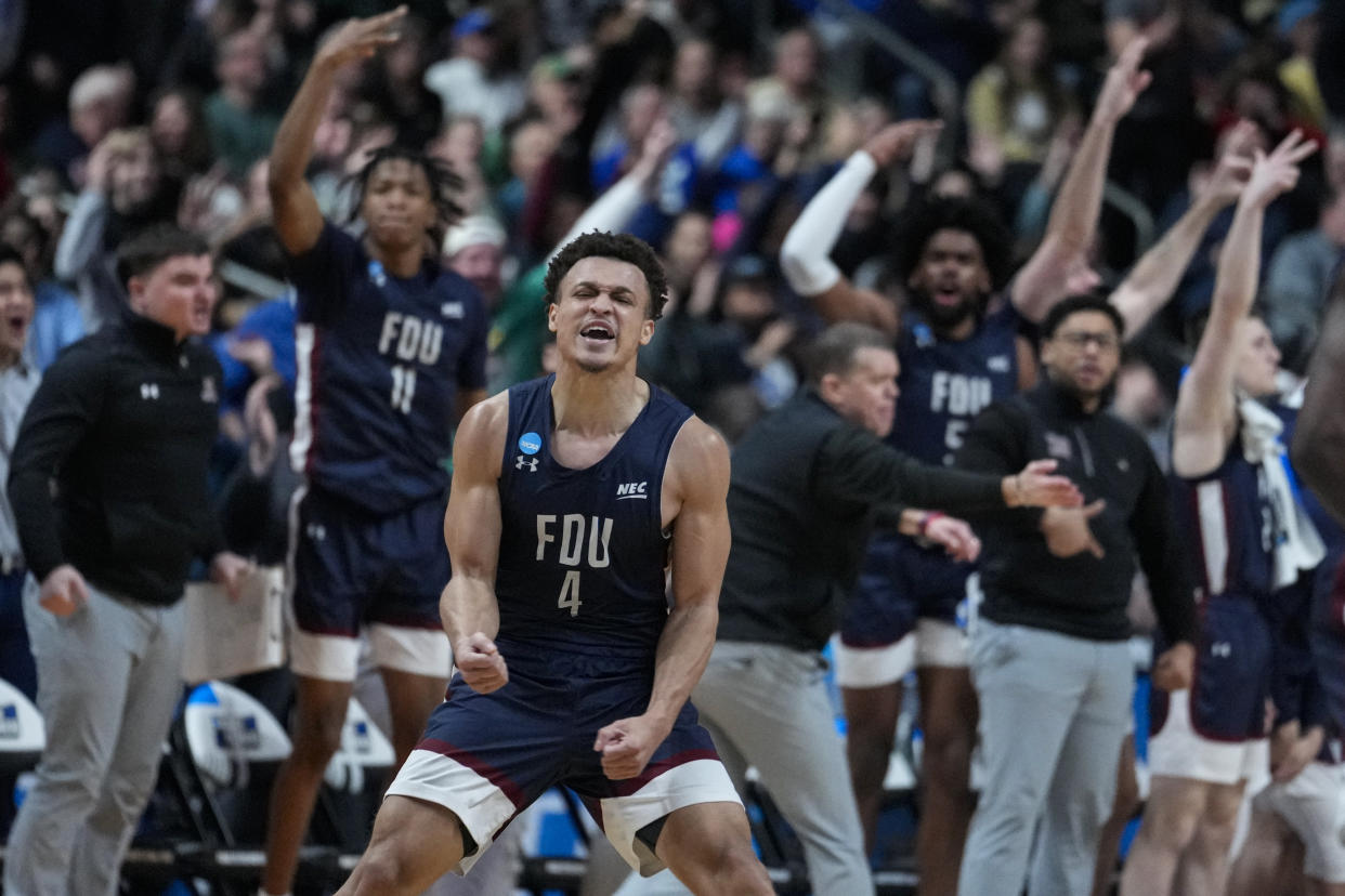 Fairleigh Dickinson guard Grant Singleton (4) celebrates after a basket against Purdue in the second half of a first-round college basketball game in the men's NCAA Tournament in Columbus, Ohio, Friday, March 17, 2023. (AP Photo/Michael Conroy)