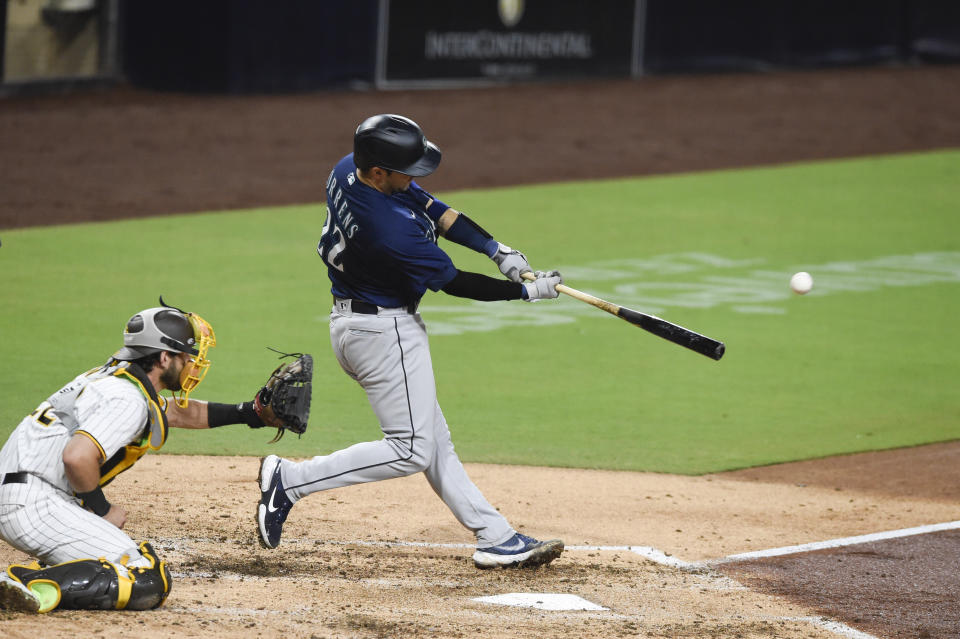 Seattle Mariners' Luis Torrens hits an RBI double during the third inning of the team's baseball game against the San Diego Padres on Saturday, Sept. 19, 2020, in San Diego. (AP Photo/Denis Poroy)