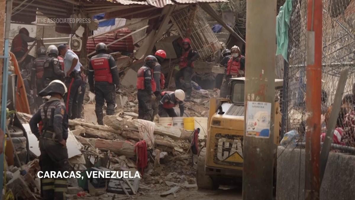 Gas tank explodes in slum in Caracas, collapsing a house with dozens inside