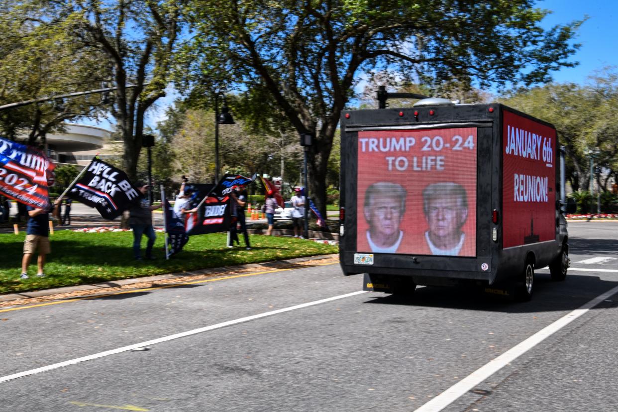 <p>Trucks outside CPAC with ‘January 6th Reunion’ on them ahead of Trump speech</p> (Photo by CHANDAN KHANNA/AFP via Getty Images)