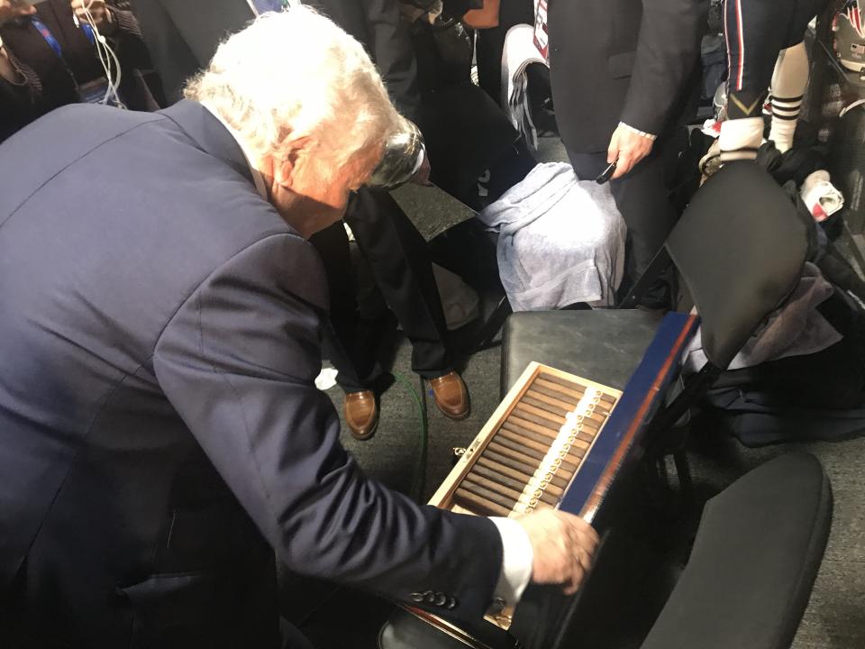 Robert Kraft opens up a box of cigars he wanted to give to his players as a gift for winning Super Bowl LIII. (Yahoo Sports)