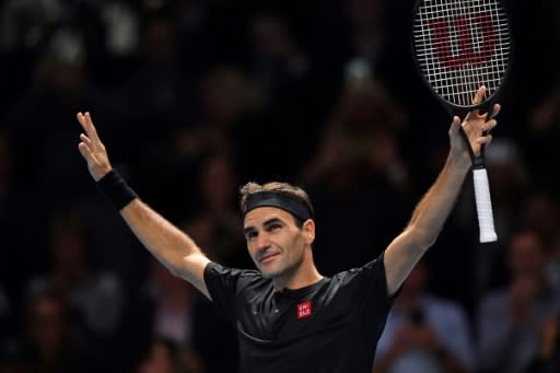 Roger Federer celebrates victory over Novak Djokovic at the ATP Finals