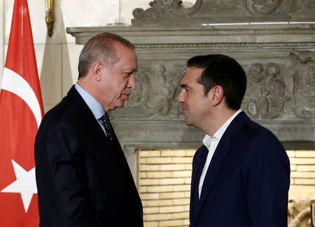 Greek Prime Minister Alexis Tsipras and Turkish President Tayyip Erdogan attend a press conference following their meeting at the Maximos Mansion in Athens, Greece December 7, 2017. REUTERS/Costas Baltas