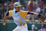 Honolulu's Jaron Lancaster delivers in the first inning of the Little League World Series Championship game against Curacao in South Williamsport, Pa., Sunday, Aug. 28, 2022. (AP Photo/Gene J. Puskar)