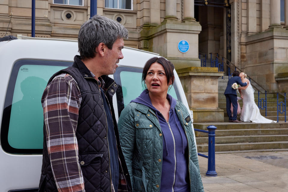 FROM ITV

STRICT EMBARGO
Print media - No Use Before Tuesday 27th June 2023
Online Media - No Use Before 0700hrs Tuesday 27th June 2023

Emmerdale - 9719

Monday 3rd July 2023

Moira Dingle [NATALIE J ROBB] and Cain Dingle [JEFF HORDLEY] hear from Nicola that Nate is heading to the town hall. Fearing he's about to do something stupid and fight for custody of Frankie, they race off to stop him. Spotting Tracy Metcalfe [AMY WALSH] in a wedding dress outside the Registry Office with an attractive man, Cain and Moira now conclude that Nate is actually planning to crash her wedding. 

Picture contact - David.crook@itv.com

Photographer - Amy Brammall

This photograph is (C) ITV and can only be reproduced for editorial purposes directly in connection with the programme or event mentioned above, or ITV plc. This photograph must not be manipulated [excluding basic cropping] in a manner which alters the visual appearance of the person photographed deemed detrimental or inappropriate by ITV plc Picture Desk. This photograph must not be syndicated to any other company, publication or website, or permanently archived, without the express written permission of ITV Picture Desk. Full Terms and conditions are available on the website www.itv.com/presscentre/itvpictures/terms
