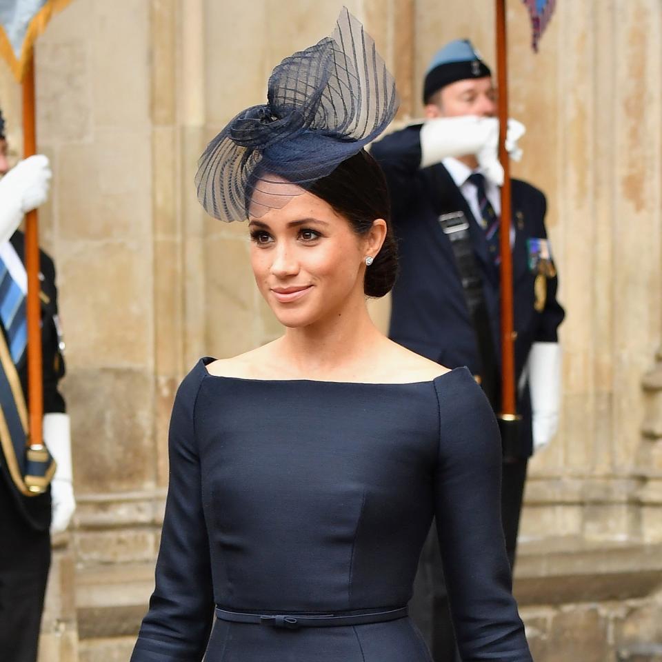 Meghan Markle, the Duchess of Sussex, took a cue from her royal wedding dress for today’s celebratory outing.