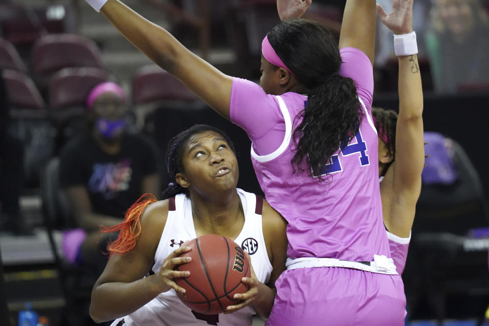 FILE - South Carolina forward Aliyah Boston looks for a shot against LSU center Faustine Aifuwa (24) during the first half of an NCAA college basketball game in Columbia, S.C., in this Sunday, Feb. 14, 2021, file photo. Boston has made The Associated Press All-America first team, announced Wednesday, March 17, 2021.(AP Photo/Sean Rayford, File)