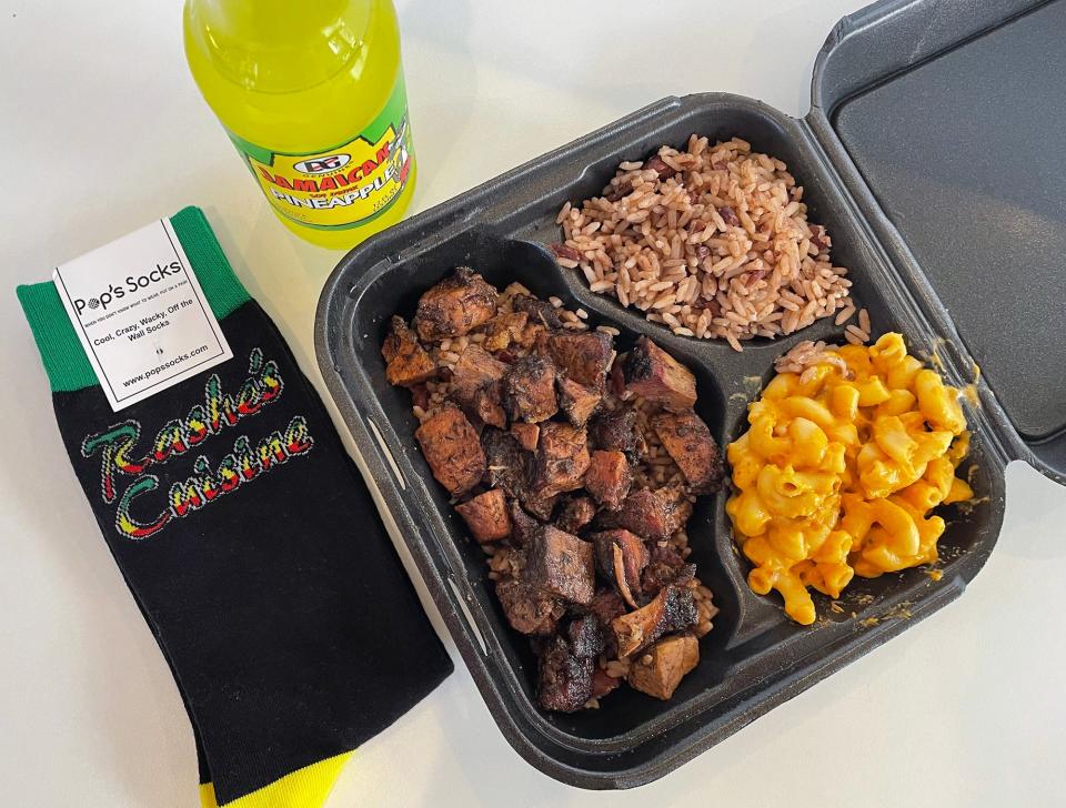 This photo from January 2023 shows a jerk pork plate with brown rice and mac and cheese from Rashe's Cuisine. Rashe's is one of the businesses participating in Athens Restaurant week (limited edition socks not included).