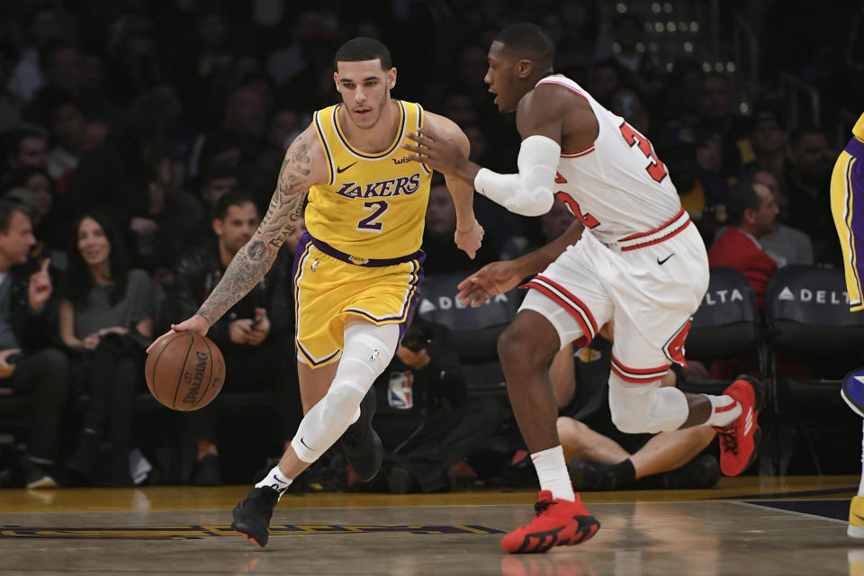 LOS ANGELES, CA - JANUARY 15: Lonzo Ball of the Los Angeles Lakers dribbles around Kris Dunn of the Chicago Bulls at Staples Center on January 15, 2019 in Los Angeles, California. NOTE TO USER: User expressly acknowledges and agrees that, by downloading and or using this photograph, User is consenting to the terms and conditions of the Getty Images License Agreement.(Photo by John McCoy/Getty Images)