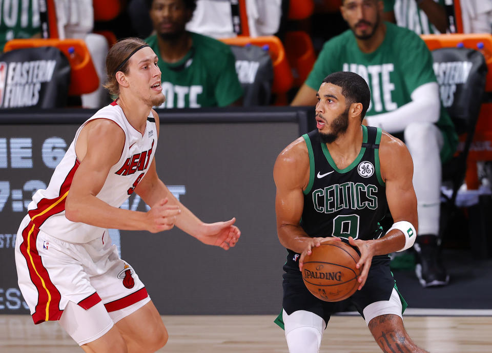 LAKE BUENA VISTA, FLORIDA - SEPTEMBER 25: Jayson Tatum #0 of the Boston Celtics drives the ball against Kelly Olynyk #9 of the Miami Heat during the second quarter in Game Five of the Eastern Conference Finals during the 2020 NBA Playoffs at AdventHealth Arena at the ESPN Wide World Of Sports Complex on September 25, 2020 in Lake Buena Vista, Florida. NOTE TO USER: User expressly acknowledges and agrees that, by downloading and or using this photograph, User is consenting to the terms and conditions of the Getty Images License Agreement.  (Photo by Mike Ehrmann/Getty Images)