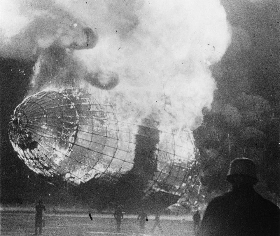 <p>The German airship ‘Hindenburg’ (LZ-129) in flames after the disaster on its arrival at Lakehurst, New Jersey on May 6, 1937. (Central Press/Getty Images) </p>