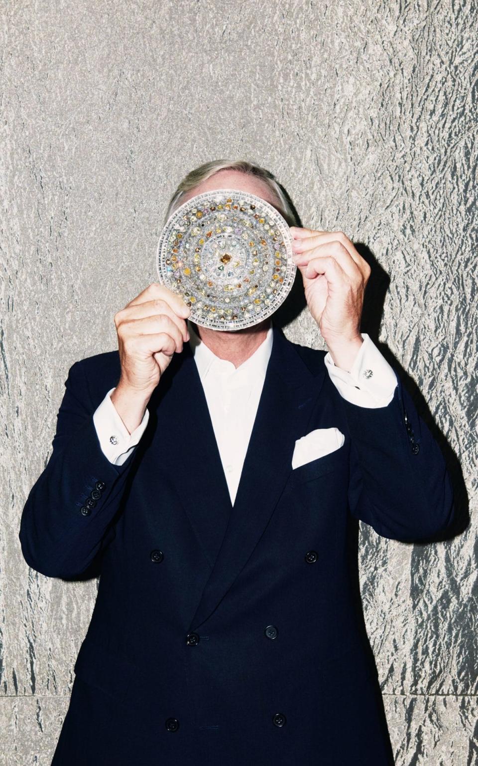 Andrew Coxon holding a De Beers Talisman Wonder in white gold with rough and polished diamonds - Benjamin McMahon