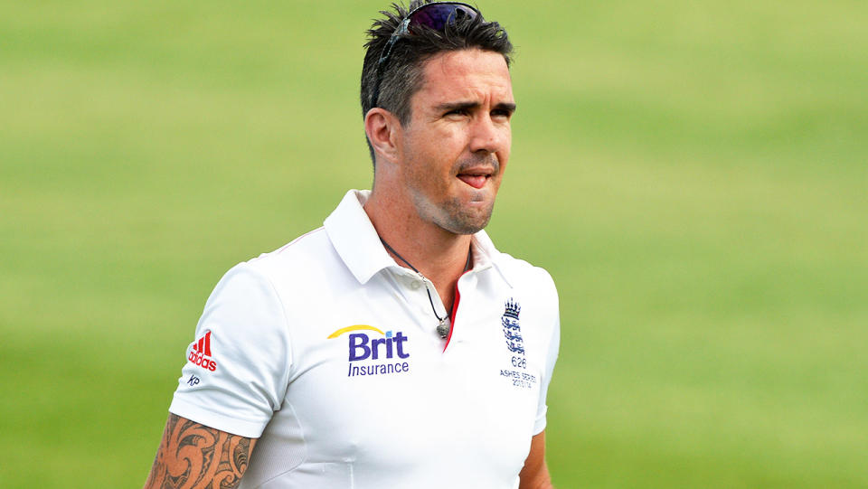 Kevin Pietersen (pictured) carrying drinks and a helmet out to teammates.