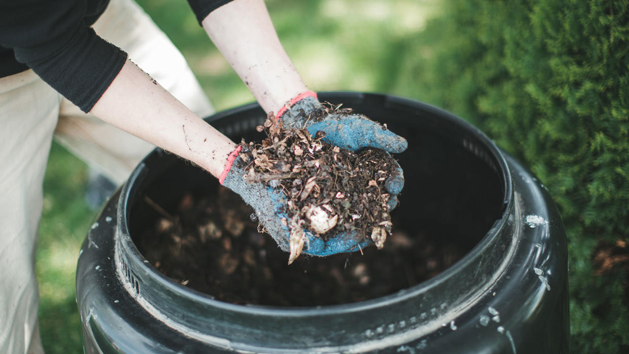  making compost in a compost bin 