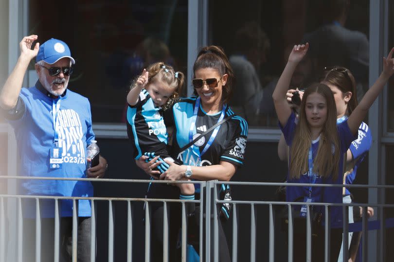 Rebekah Vardy watches the open-top bus parade in Leicester to celebrate winning the Sky Bet Championship title