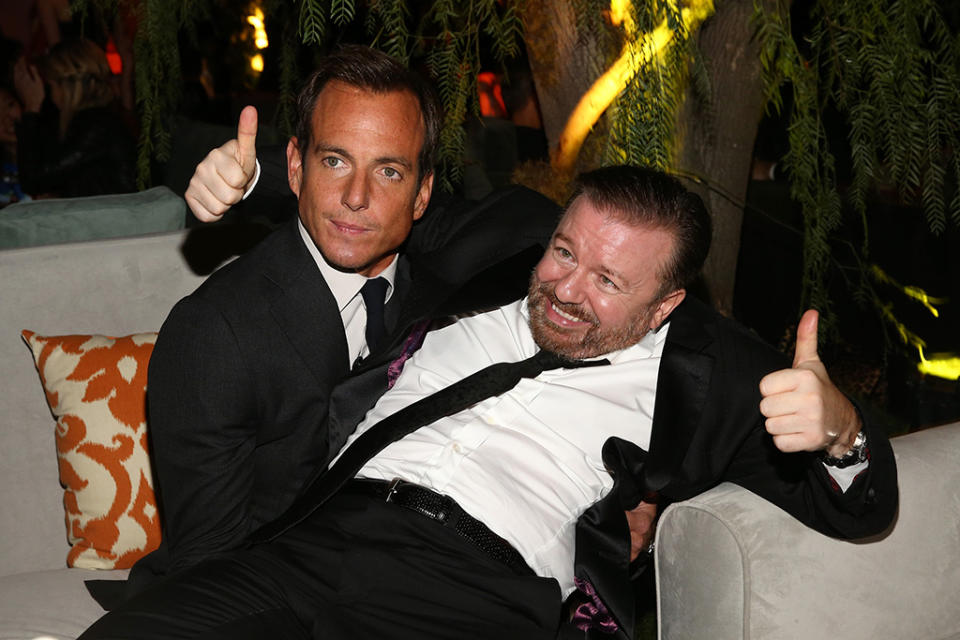 <p>There’s a reason why they call it a party! It’s precisely because of moments like this, in which Gervais, right, made himself at home on Arnett’s lap at the 2015 event. (Photo: Rich Polk/Getty Images for Fiji Water) </p>