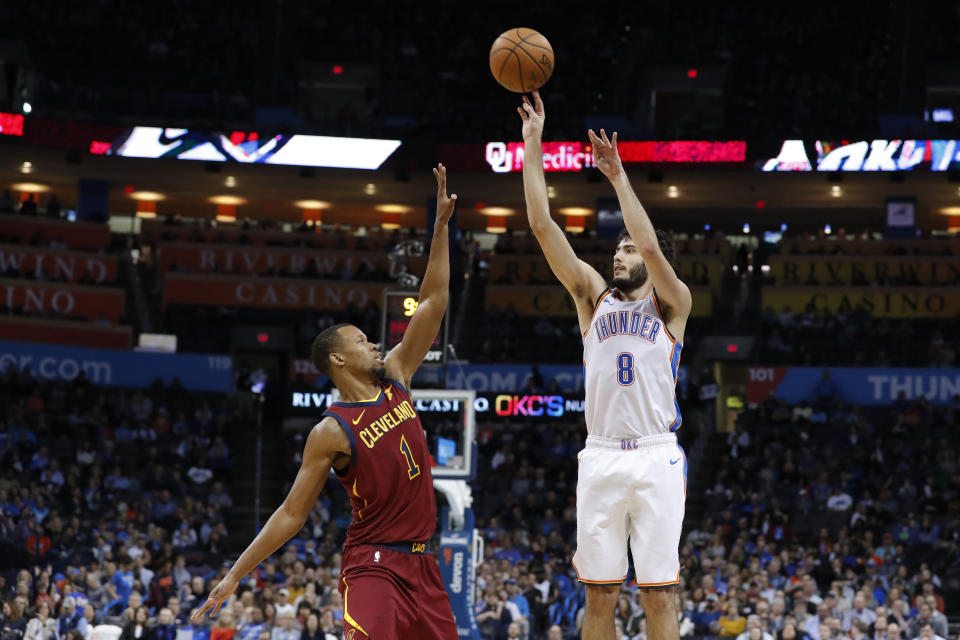 Oklahoma City Thunder guard Alex Abrines (8) shoots over Cleveland Cavaliers guard Rodney Hood (1) during the second half of an NBA basketball game in Oklahoma City, Wednesday, Nov. 28, 2018. Oklahoma City won 100-83. (AP Photo/Alonzo Adams)