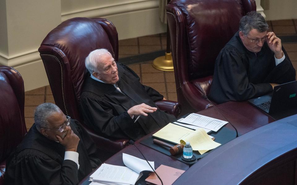 Mississippi Supreme Court Presiding Justice James W. Kitchens, center, addresses a question to an attorney as Justices Leslie D. King, left, and Josiah D. Coleman, right, listen during oral arguments regarding HB 1020 in Jackson, Miss., Wednesday, July 6, 2023. HB 1020 would significantly increase state control over Jackson's judicial system and policing.