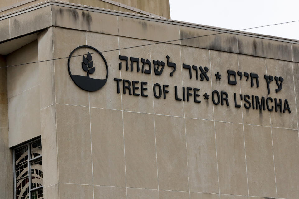 FILE - In this Saturday, Nov. 3, 2018 file photo, The signs for the Tree of Life Synagogue is shown on the building in Pittsburgh. Community service projects, an overseas concert and a virtual remembrance are among multiple ways the deadliest attack on Jews in U.S. history will be commemorated. Sunday marks the one-year anniversary of the shooting at the Tree of Life synagogue in Pittsburgh that killed 11 worshippers and injured seven. (AP Photo/Keith Srakocic, File)