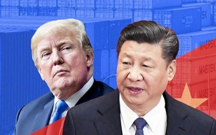 An image of Donald Trump and Chinese president Xi Jinping, super-imposed over the flags and colours of their respective nations - Telegraph