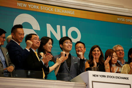 Chinese electric vehicle start-up Nio Inc’s first employee Tianshu LI, and company’s leadership team celebrate at the New York Stock Exchange (NYSE) Opening Bell to commemorate the company’s initial public offering (IPO) at the NYSE in New York, U.S., September 12, 2018. REUTERS/Brendan McDermid