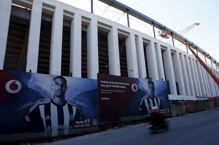 Employees work on the construction of Vodafone Arena, which will be the new home ground of Turkish Soccer team Besiktas replacing the old Inonu Stadium, in Istanbul, Turkey February 2, 2016. REUTERS/Murad Sezer