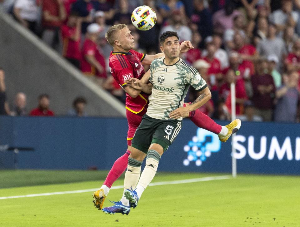 St. Louis City defender Tomas Totland (14) and Portland Timbers defender Claudio Bravo (5) go up for a header during the first half of an MLS soccer game at CityPark stadium in St. Louis on Saturday, June 8, 2024. (Dominic Di Palermo/St. Louis Post-Dispatch via AP)
