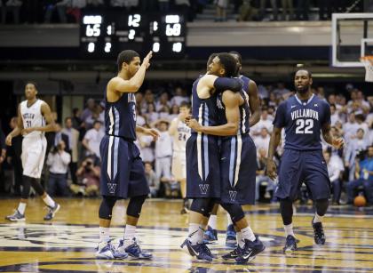 Darrun Hilliard hugs guard Ryan Arcidiacono (15) after hitting the game-winning shot on Saturday. (AP)